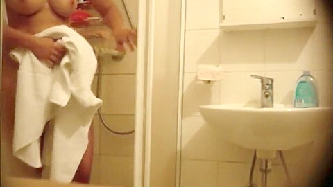 Seductive honey unveils her body before taking a shower | watch  HD hidden camera sex movie for free