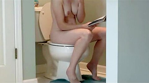 Watching a patient girl read at a toilet | watch  HD spy camera porn video for free