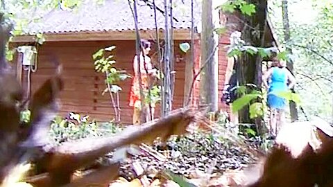 Woman in blue dress pissing next to wood shelter | watch  HD spy cam porn movie for free
