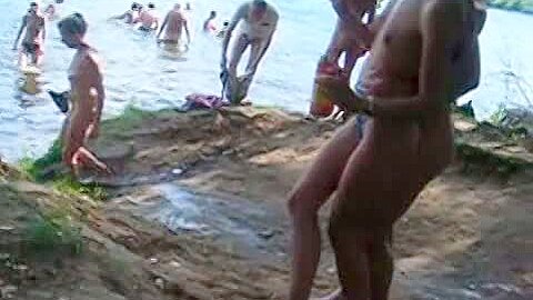Hidden cam video taken while strolling through a nudist beach | watch  HD candid cam xxx movie for free